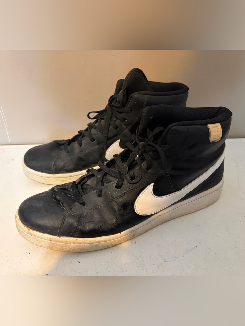 Nike Black High-Top Sneakers with White Swoosh